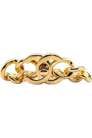 CHANEL Pulsera bañada en oro con cierre giratorio CC 1996