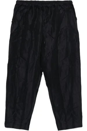 Comme des Garçons Pantalones a rayas diplomáticas