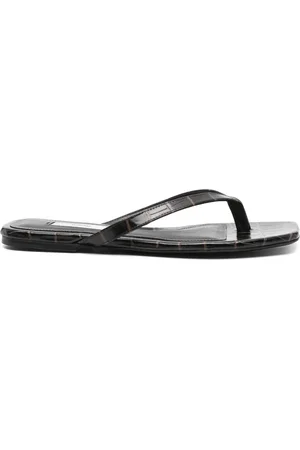 Totême Chanclas con motivo de piel de cocodrilo en relieve