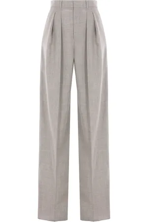 Saint Laurent Pantalones anchos de lana con bolsillos