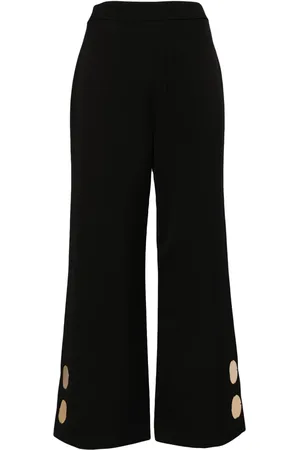 ALEXIS Pantalones acampanados con apliques metalizados
