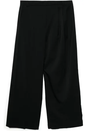 pushBUTTON Pantalones asimétricos con detalle lateral