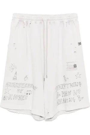Maison Mihara Yasuhiro Bermudas descoloridas con estampado de grafiti