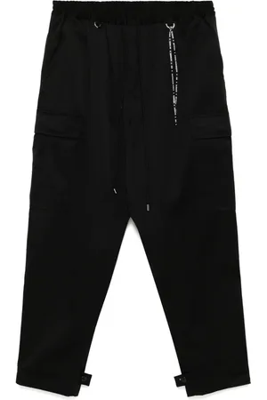 MASTERMIND Pantalones con logo bordado
