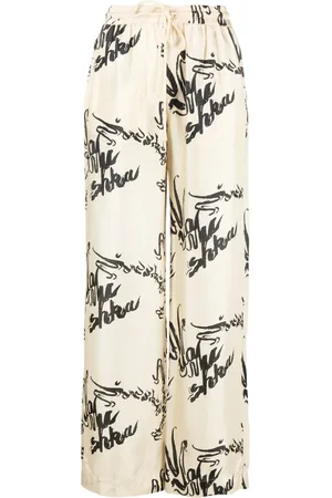 Nanushka Pantalones Jarine con estampado de caligrafía