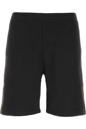Alexander McQueen Pantalones de chándal con franja del logo