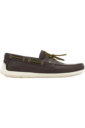 Salvatore Ferragamo An iconic slip on for off-duty looks, this deck shoe is made of calfskin dyed with vegetable anilines to give the leather a soft, supple ...