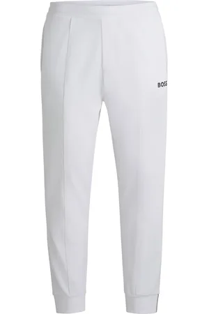 HUGO BOSS Pantalones regular fit en tejido de gabardina elástico con detalle de logo