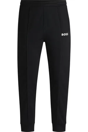 HUGO BOSS Pantalones regular fit en tejido de gabardina elástico con detalle de logo