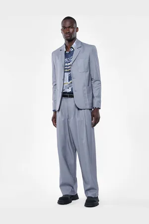 Imperial Pantalones con pliegues amplios y detalles modernos