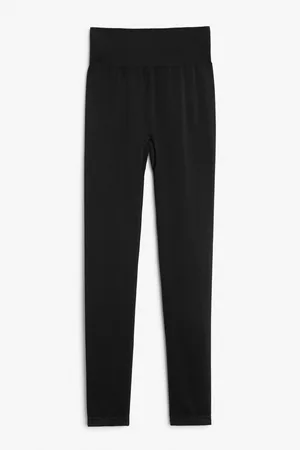 Pantalones negros de pernera slim con tiras en la cintura de Monki