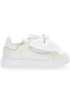 MONNALISA Zapatillas con purpurina y lazo.