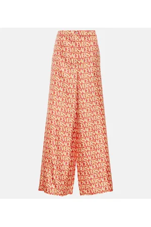 VERSACE Pantalones anchos de seda con logo
