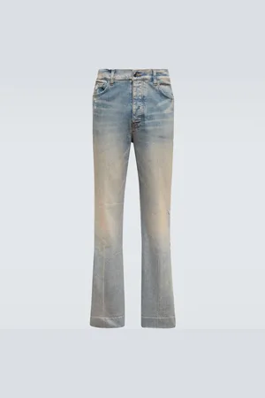 AMIRI Jeans en denim desgastados