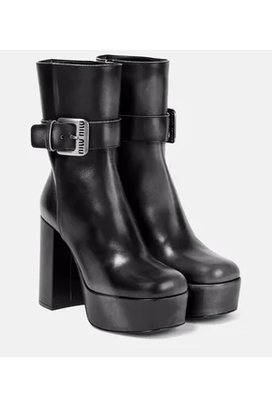 Miu Miu Botines de piel con plataforma