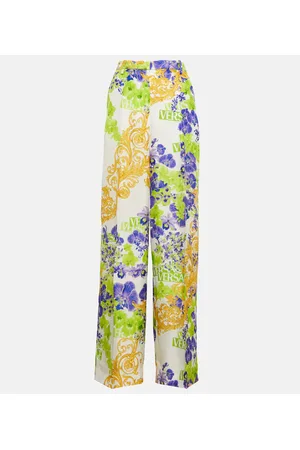 VERSACE Pantalones anchos florales