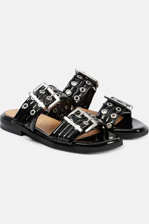 Ganni Sandalias de charol con tachuelas