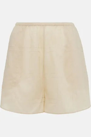 Totême Shorts de mezcla de algodón con monograma