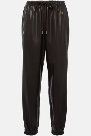 Stella McCartney Pantalones deportivos de piel sintética