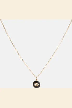 Gucci Collar de oro de 18 ct con ónice, diamante y GG