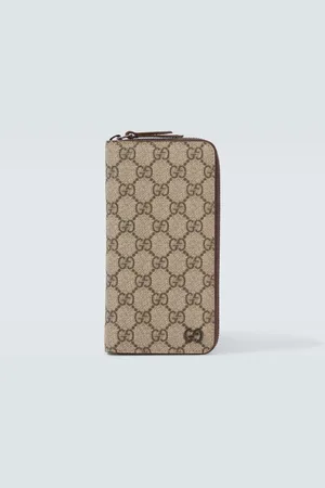 Gucci Cartera plegable de lona GG y piel