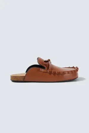 J.W.Anderson Mules de piel adornados