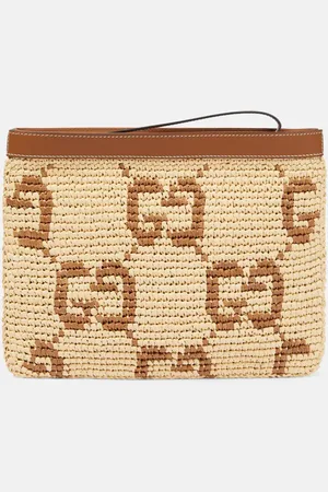 Gucci Clutch con piel y GG
