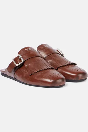Prada Mules Shuffle de piel con flecos