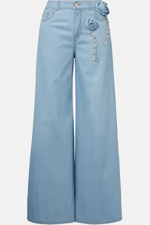 AREA Jeans anchos con aplique floral