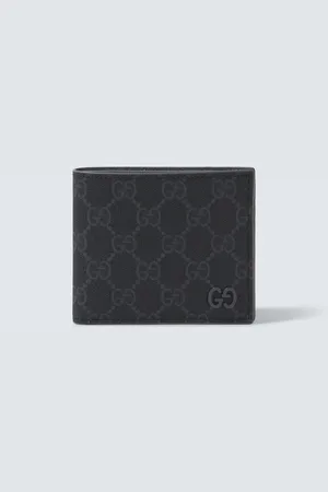 Gucci Cartera plegable de lona GG