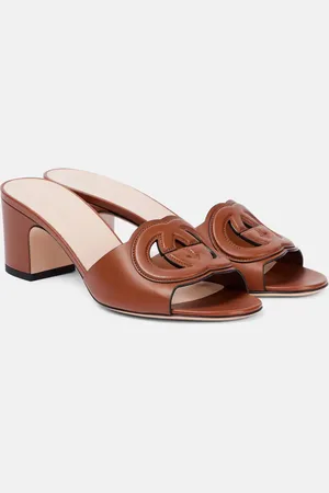 Gucci Mules de piel con GG