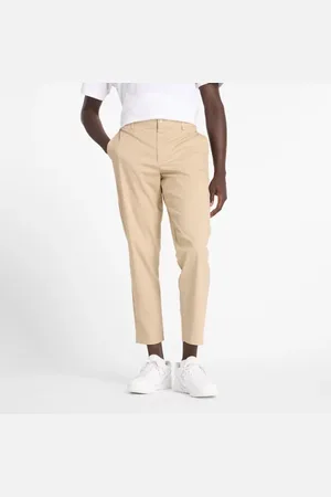 New Balance Hombre Athletics Standard Tapered Pant 28", Sarga de algodón, Talla 2XL