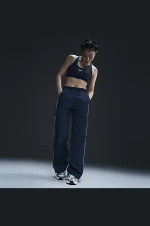 Nike Windrunner Pantalón de talle alto y tejido Woven con dobladillo abierto - Mujer