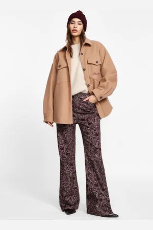 Please Pantalones acampanados con estampado