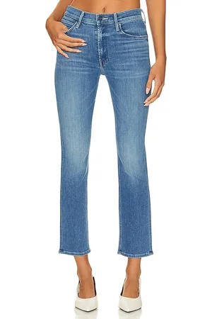 REVOLVE MOTHER Mother jeans acampanados de tiro medio dazzler en color denim-medium talla 24 en - Denim-Medium. Talla 24 (también en 34).