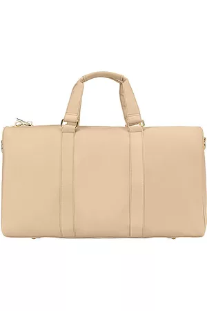 REVOLVE Stoney Clover Lane Stoney clover lane bolsa fácil de transportar classic duffle bag en color bronce talla all en - Tan. Talla all.