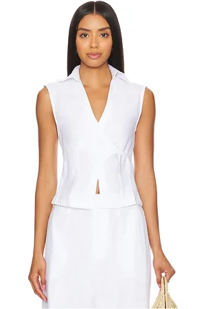 REVOLVE FAITHFULL THE BRAND Faithfull the brand camisa cruzada sin mangas antibes en color talla S en - White. Talla S (también en XL, XS).