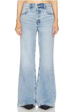 REVOLVE GRLFRND Grlfrnd pantalones acampanados relajados de talle bajo jade en color denim claro talla 27 en - Denim-Light. Talla 27 (también en