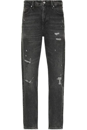 REVOLVE Tommy Jeans Tommy jeans isaac relaxed tapered jeans en color negro talla 30 en - Black. Talla 30 (también en 36).