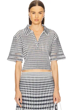 REVOLVE SIMKHAI Simkhai polo recortado adley en color azul marino talla L en - Navy. Talla L (también en M, S, XS).