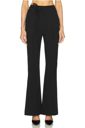 REVOLVE ROTATE Rotate pantalón acampanado en color talla 32 en - Black. Talla 32 (también en 34, 36, 38, 40).