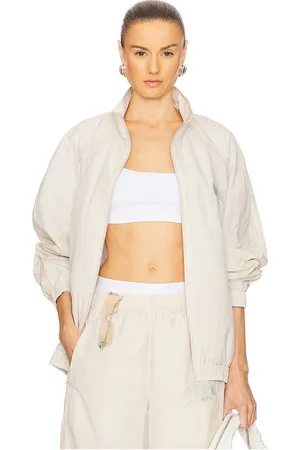 REVOLVE Alexander Wang Alexander wang chaqueta deportiva unisex en color ivory talla L en - Ivory. Talla L (también en S, XS).