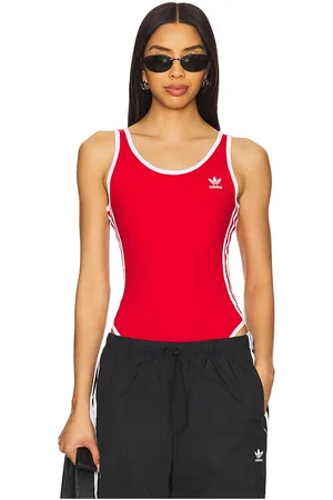REVOLVE Adidas Originals Adidas originals body 3 stripe en color rojo talla L en - Red. Talla L (también en M, S, XS).