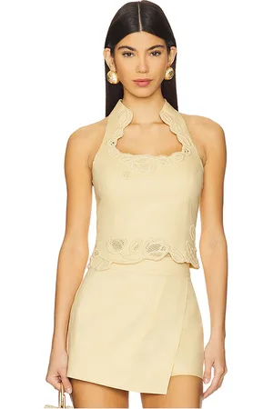 REVOLVE Cult Gaia Cult gaia top sin mangas ruthie en color amarillo limon talla 0 en - Lemon. Talla 0 (también en 2, 4).