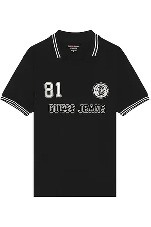 REVOLVE Guess Jeans Guess jeans polo de fútbol en color negro talla L en - Black. Talla L (también en M, S, XL/1X).