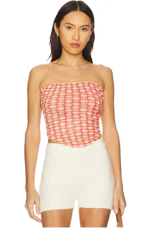 REVOLVE Free People Free people top sin tirantes boulevard en color rojo talla L en - Red. Talla L (también en M, S, XL, XS).