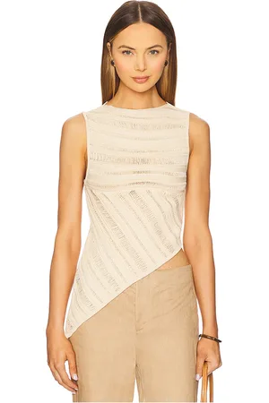 REVOLVE NONchalant Label Nonchalant label top sin mangas banks en color nude talla L en - Nude. Talla L (también en M, S, XL, XS).