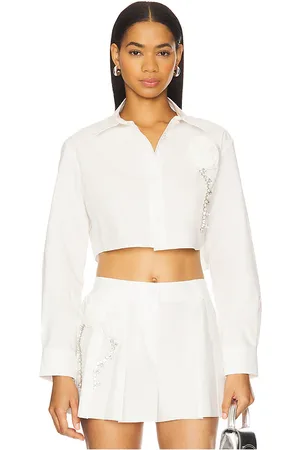 REVOLVE AREA Area crystal rosette poplin cropped shirt en color ivory talla 0 en - Ivory. Talla 0 (también en 2, 4, 6).