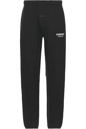 REVOLVE Fear of God ESSENTIALS Fear of god essentials pantalón deportivo classic en color negro talla L en - Black. Talla L (también en M, S, X