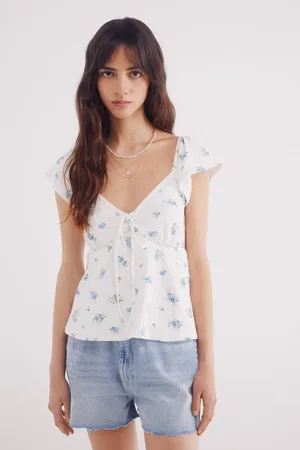 Springfield Top escote lazo bordado suizo